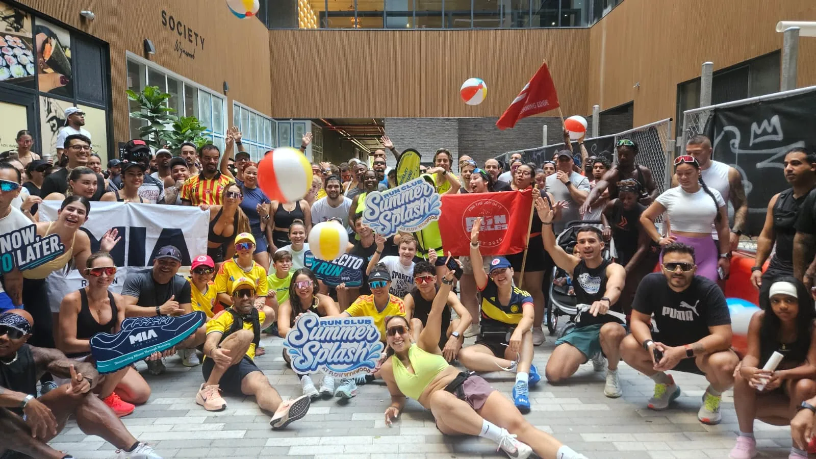 MIA Run Club Summer Splash community event group photo at Flow Wynwood, Miami - August 2026